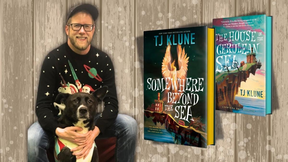 Author TJ Klune to left of two of his novels