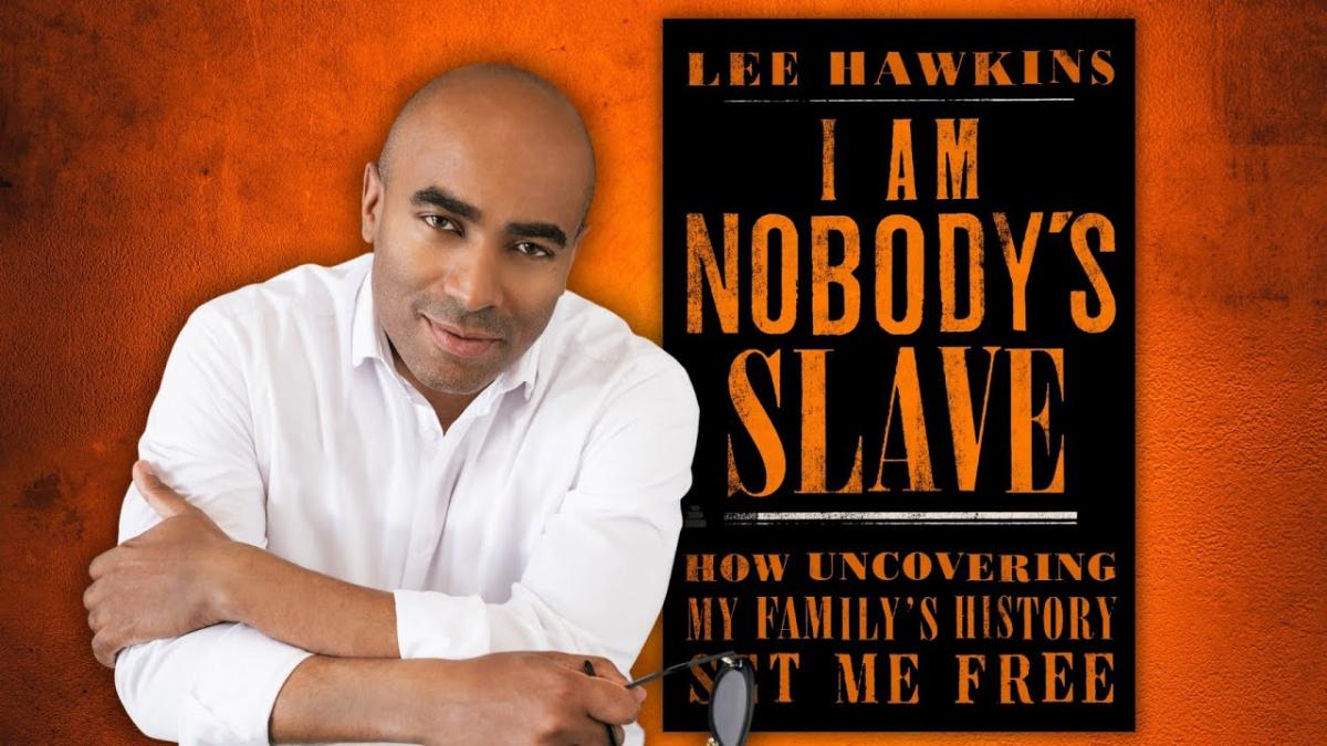 Lee Hawkins to left of his book I Am Nobody's Slave